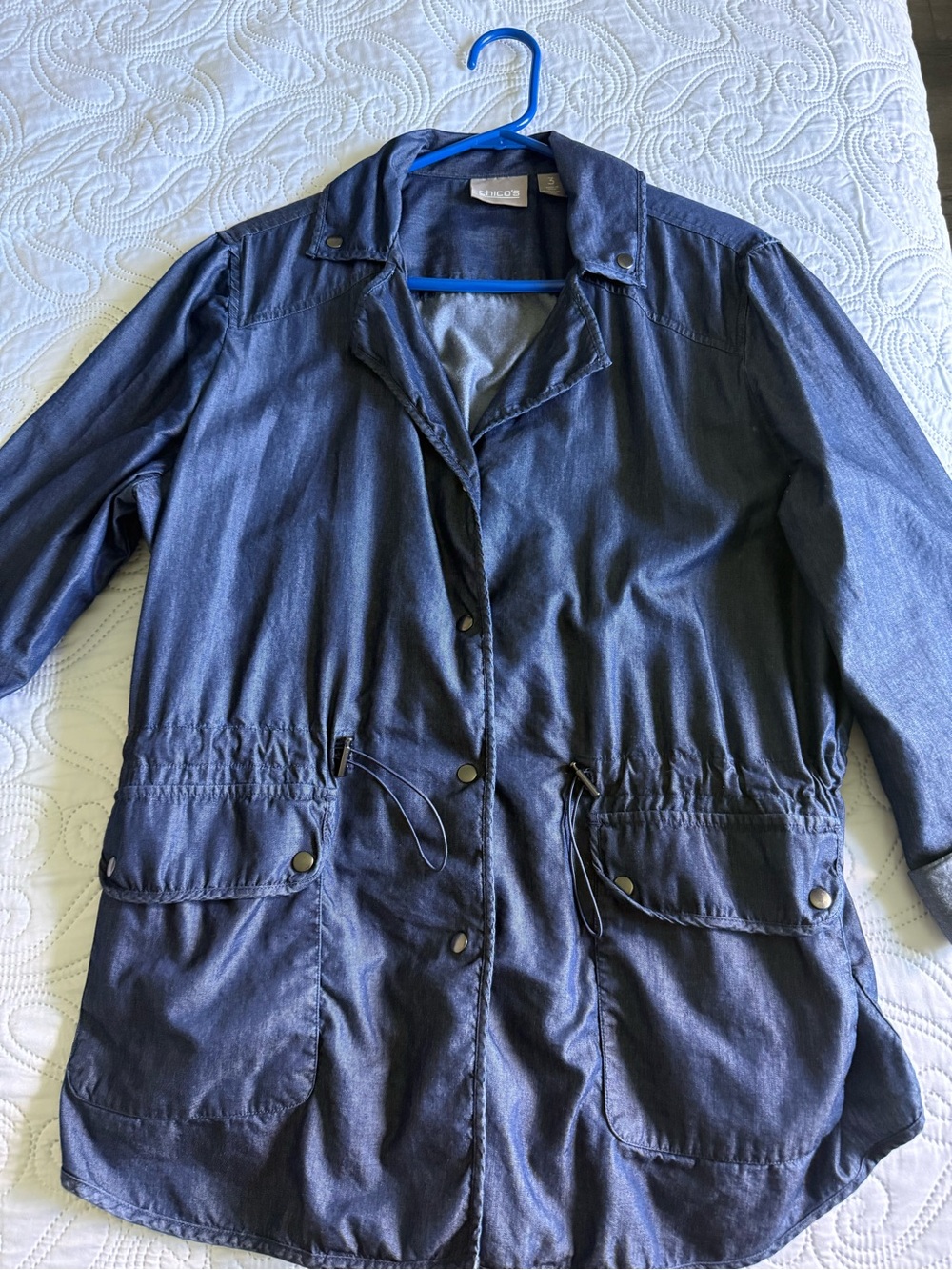 Chico’s navy blue lightweight jacket with drawstring waist and pockets.